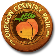 Oregon Country Fair text on a wooden sign with a peach in the middle