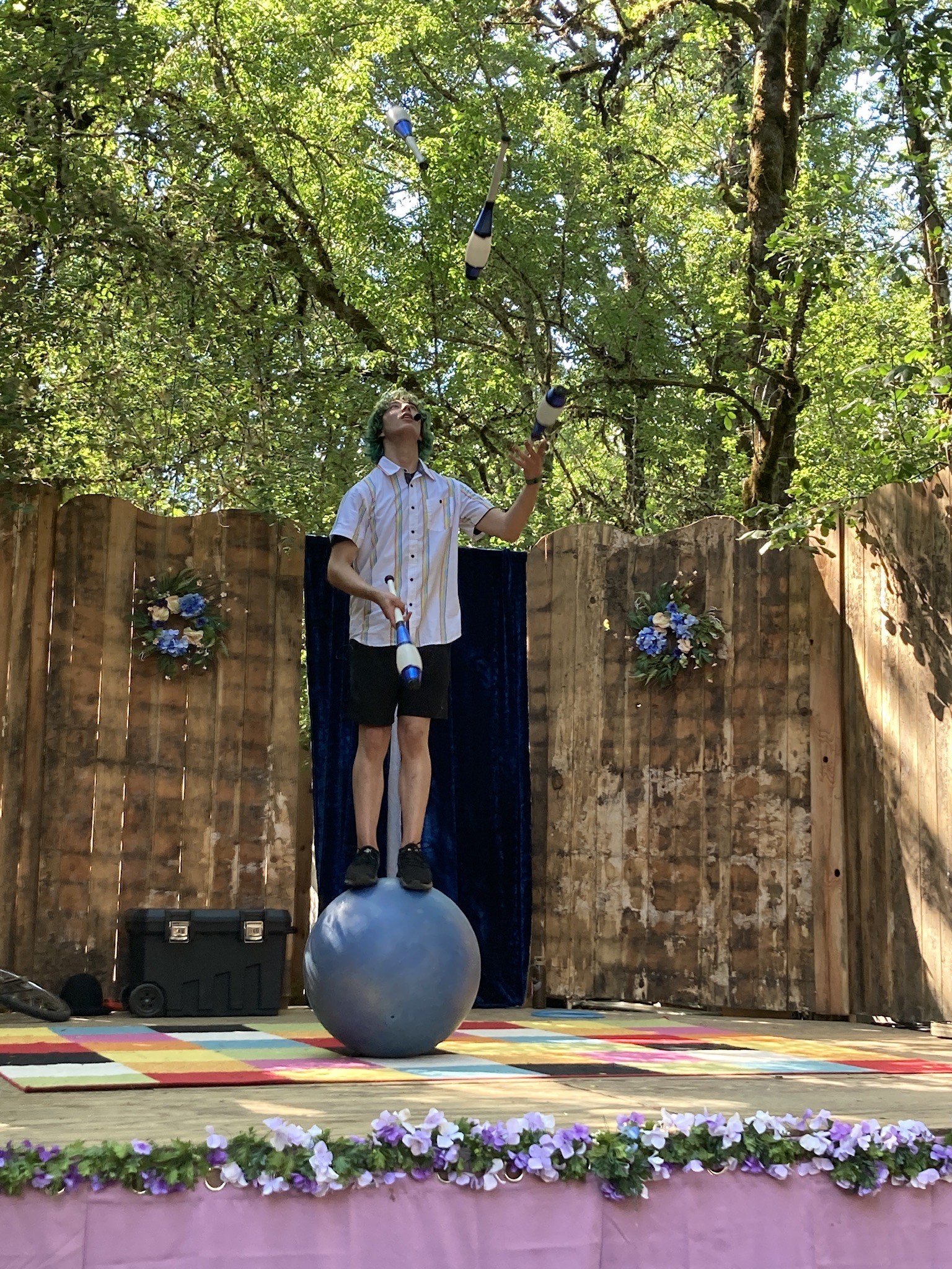 Kai Heartlife juggles on a balancing ball