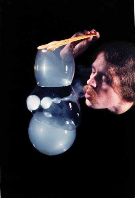 Photo of Tom Noddy, blowing bubbles