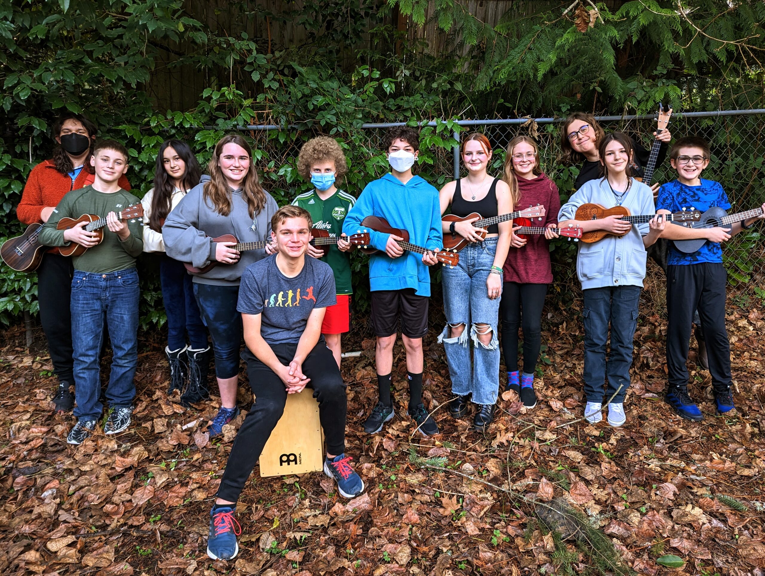 The Ridgeline Ukulele Extravaganza stands with their instruments